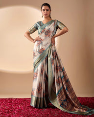 Woman wearing a traditional saree with a patterned design on a plain background