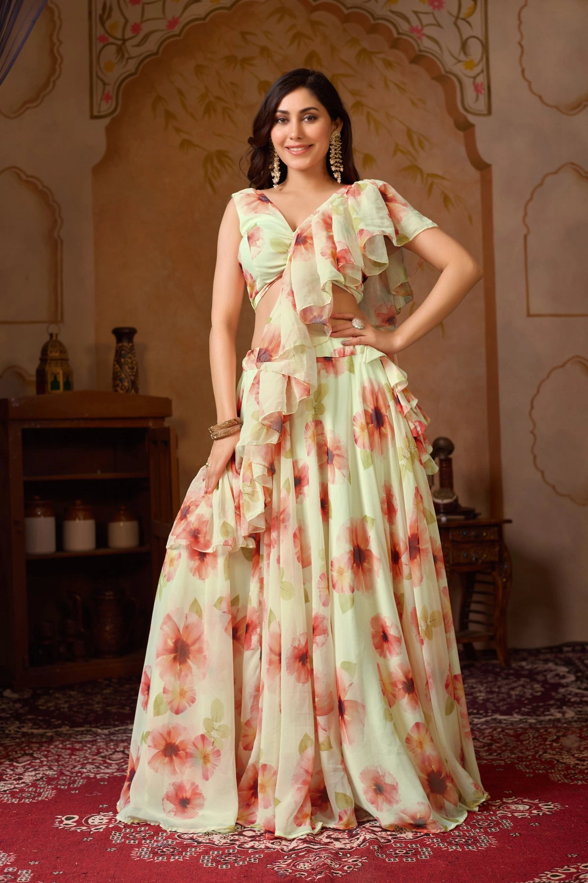 Woman in a floral dress standing in an ornate room.