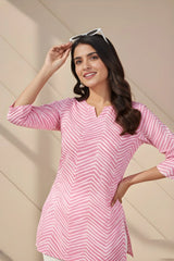 Close-up of light pink short kurti highlighting fine digital print craftsmanship.