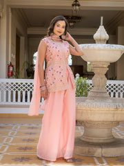 Elegant light pink embroidered georgette suit featuring intricate floral patterns.