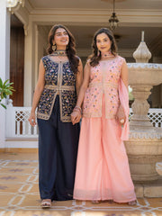Light pink georgette suit showcasing heavy embroidery craftsmanship.