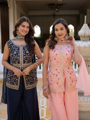 Traditional light pink georgette suit with rich embroidery work.
