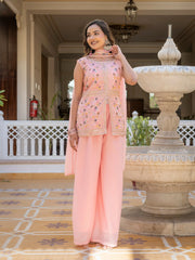 Traditional embroidered georgette suit in light pink with ornate neckline design.