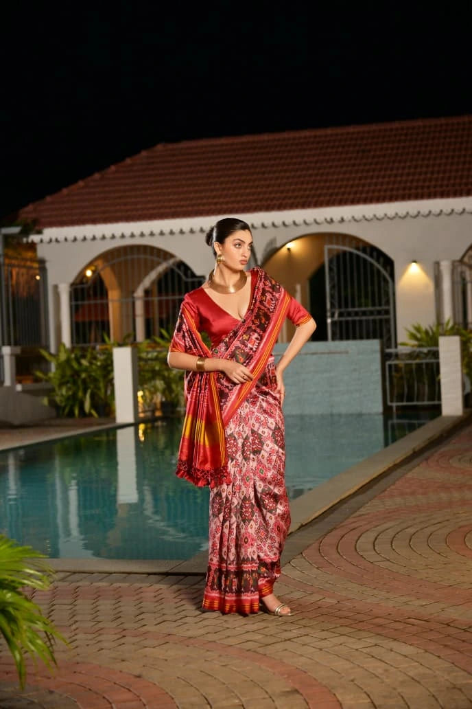 Elegant handcrafted soft silk saree in light pink featuring geometric Ikkat design