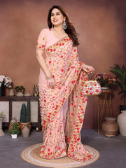 Woman in a floral saree standing in a decorated room with plants and vases.