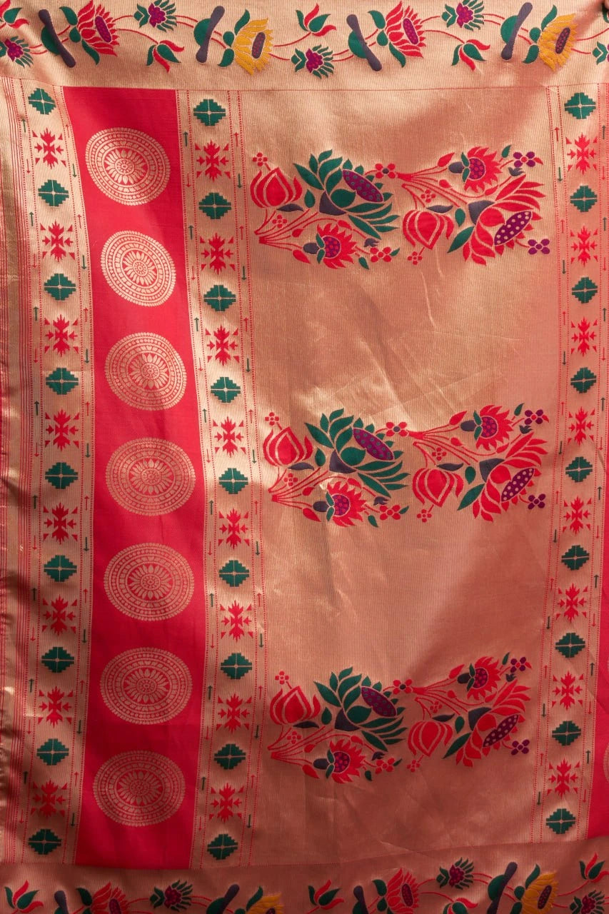 Decorative fabric with floral patterns and red border on peach background