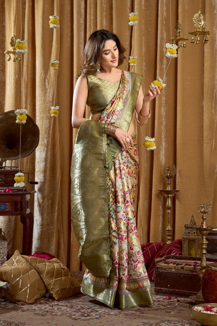 Woman in a green saree with a floral pattern in an ornate room.