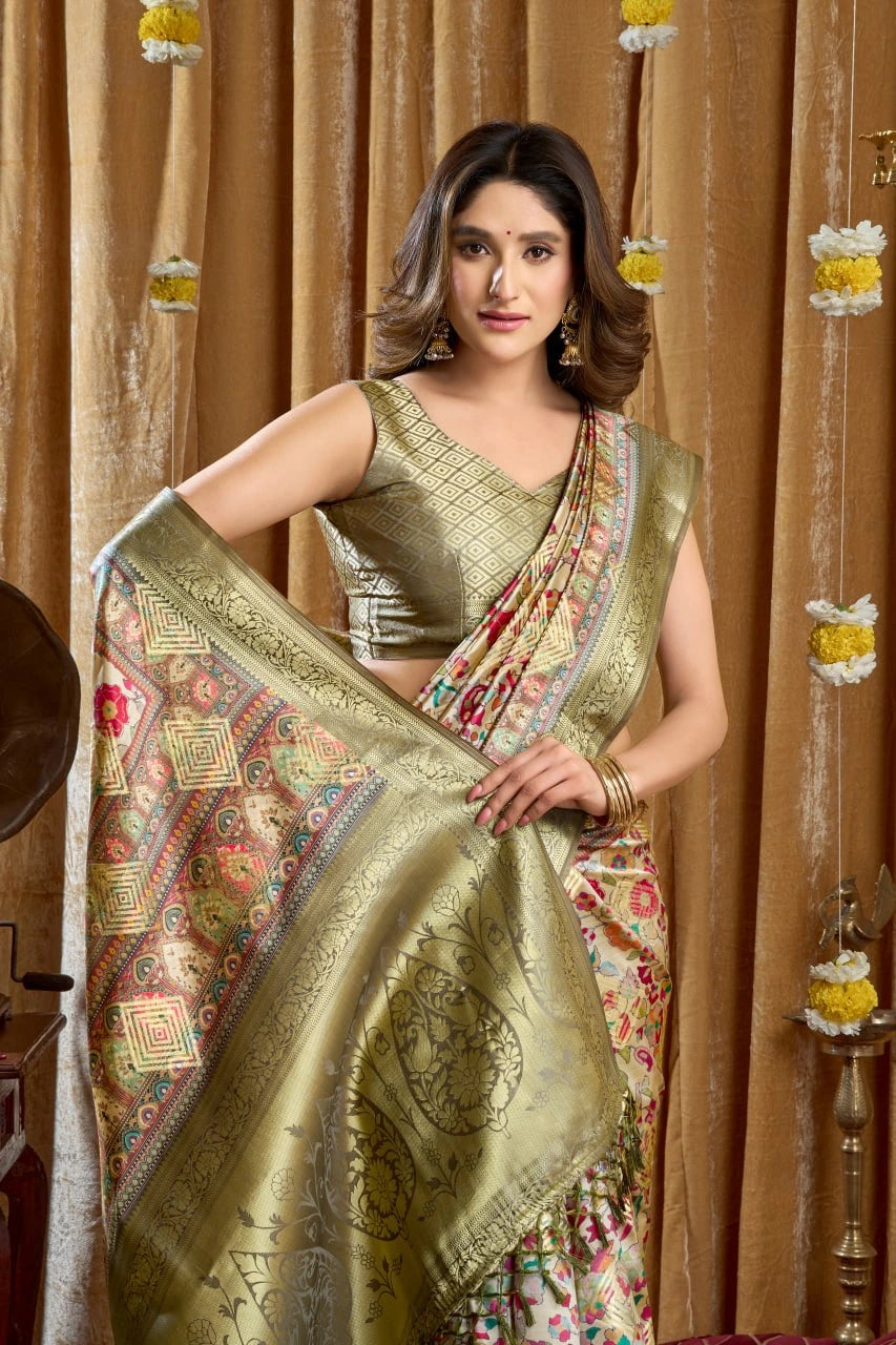 Woman holding a traditional saree with a decorative backdrop