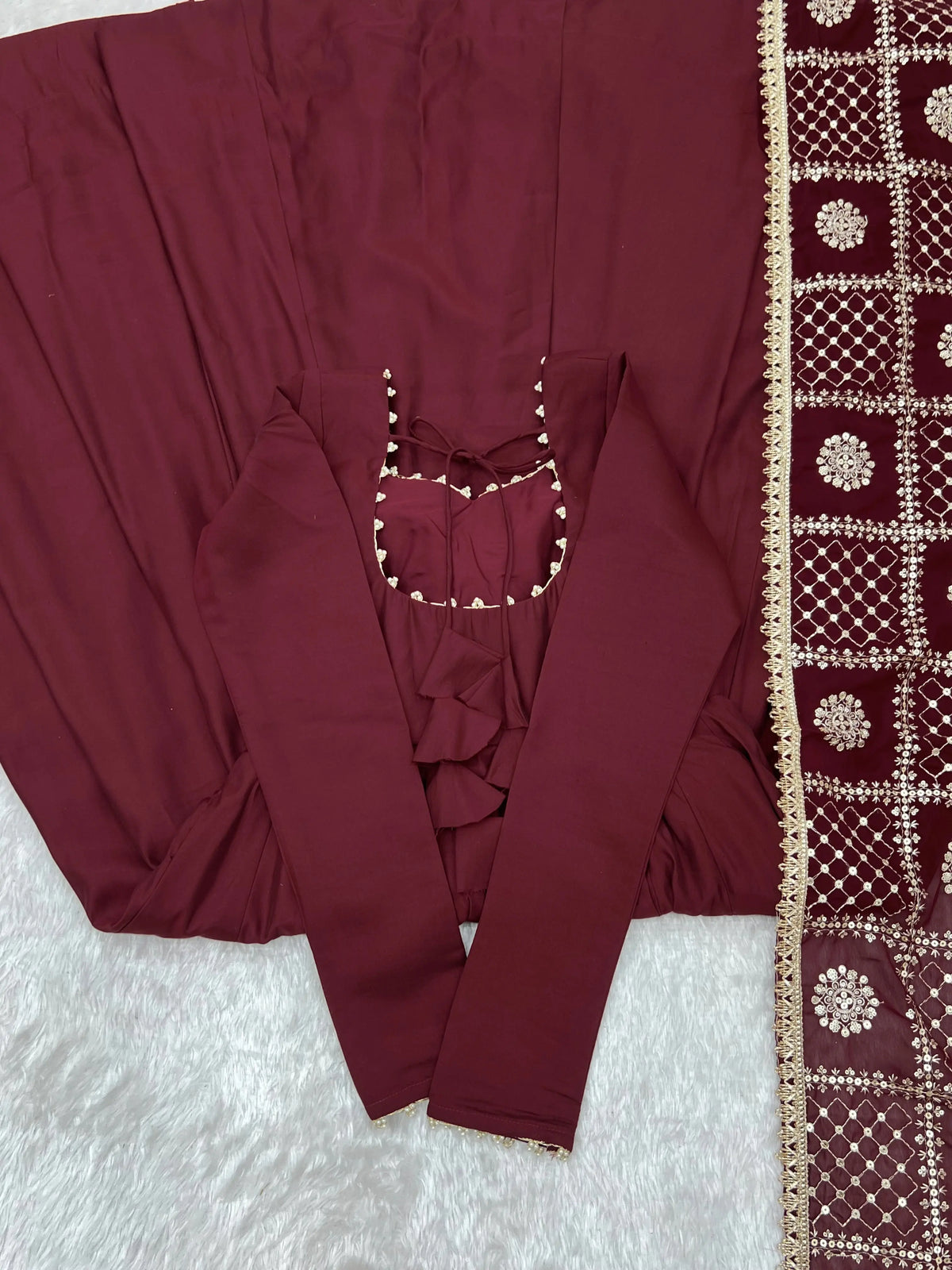 Flat lay of Maroon Sequins Embroidered Anarkali Suit with pant and back detail
