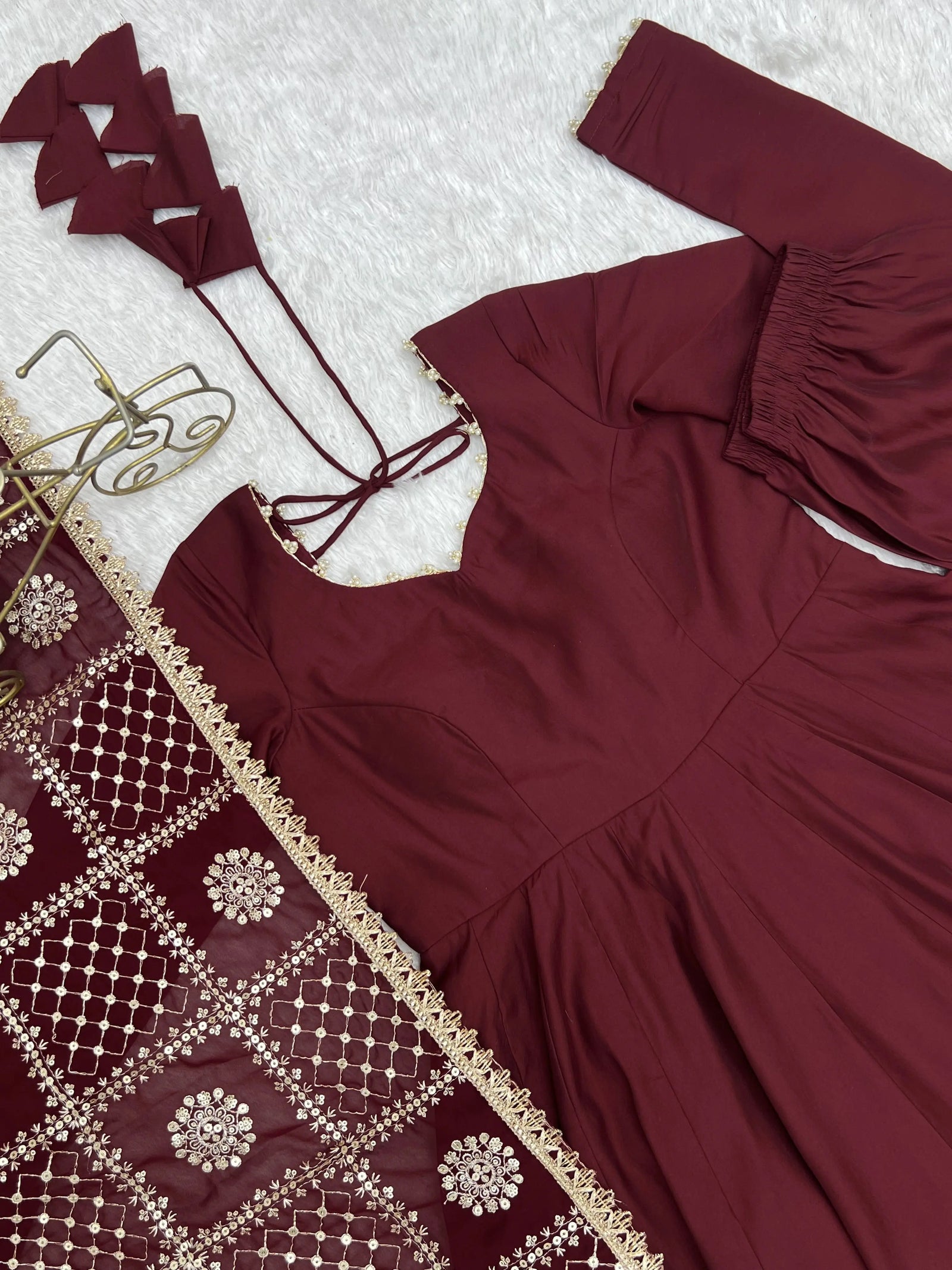 Flat lay close-up of Maroon Anarkali Suit neck and sequins embroidered dupatta