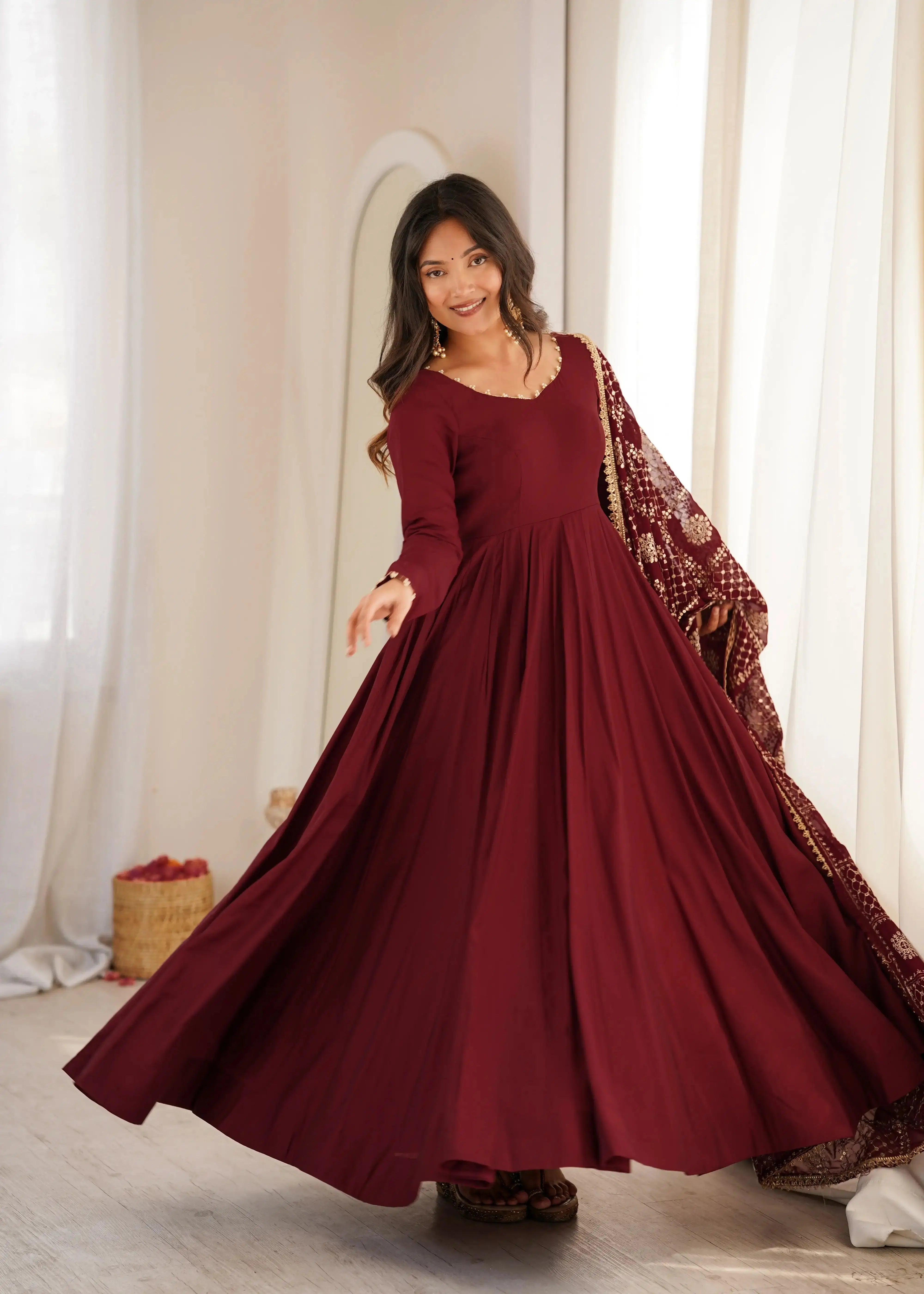 Maroon Sequins Embroidered Anarkali Suit model twirling showing full flare