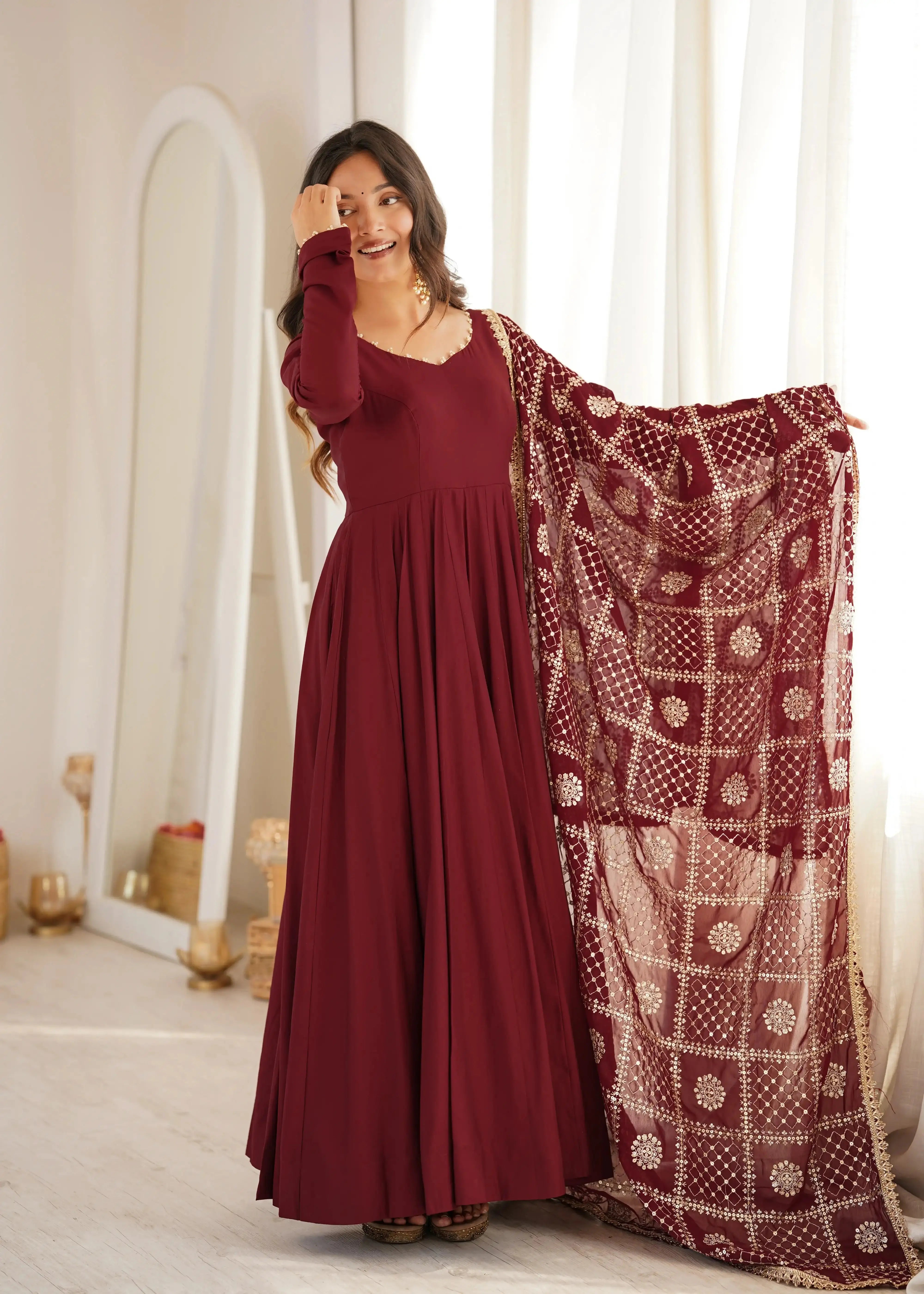 Maroon Sequins Embroidered Anarkali Suit front pose with gold jhumkas