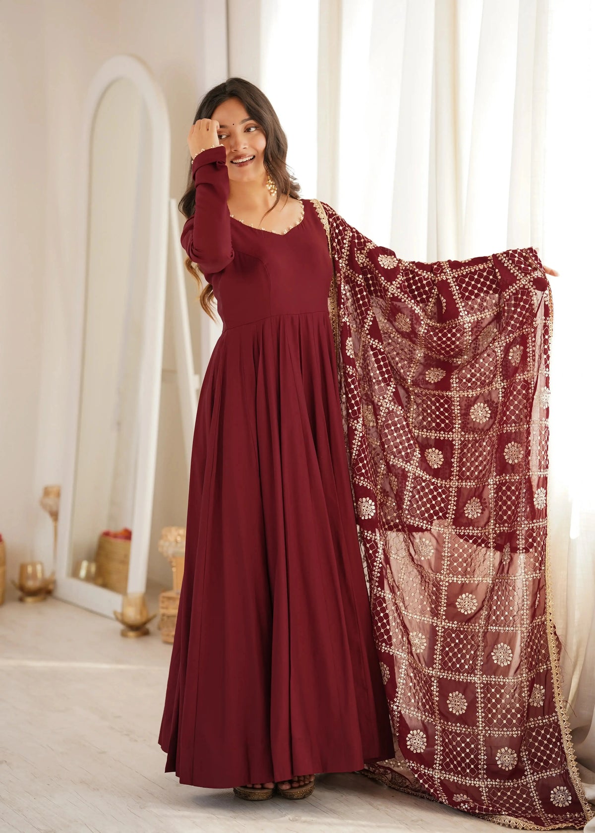 Maroon Sequins Embroidered Anarkali Suit front pose with gold jhumkas