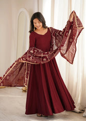 Maroon Sequins Embroidered Anarkali Suit model holding embroidered dupatta