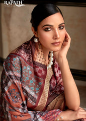 Woman wearing a patterned shawl with 'Rapath' branding in the corner.