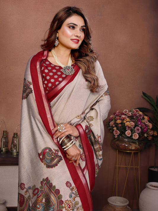 Woman in a traditional saree with a decorative pattern against a brown background