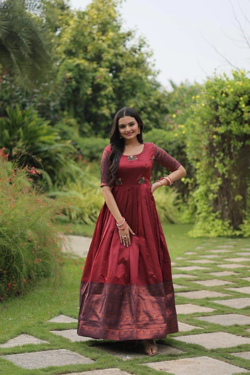 Woman in a red dress standing in a garden