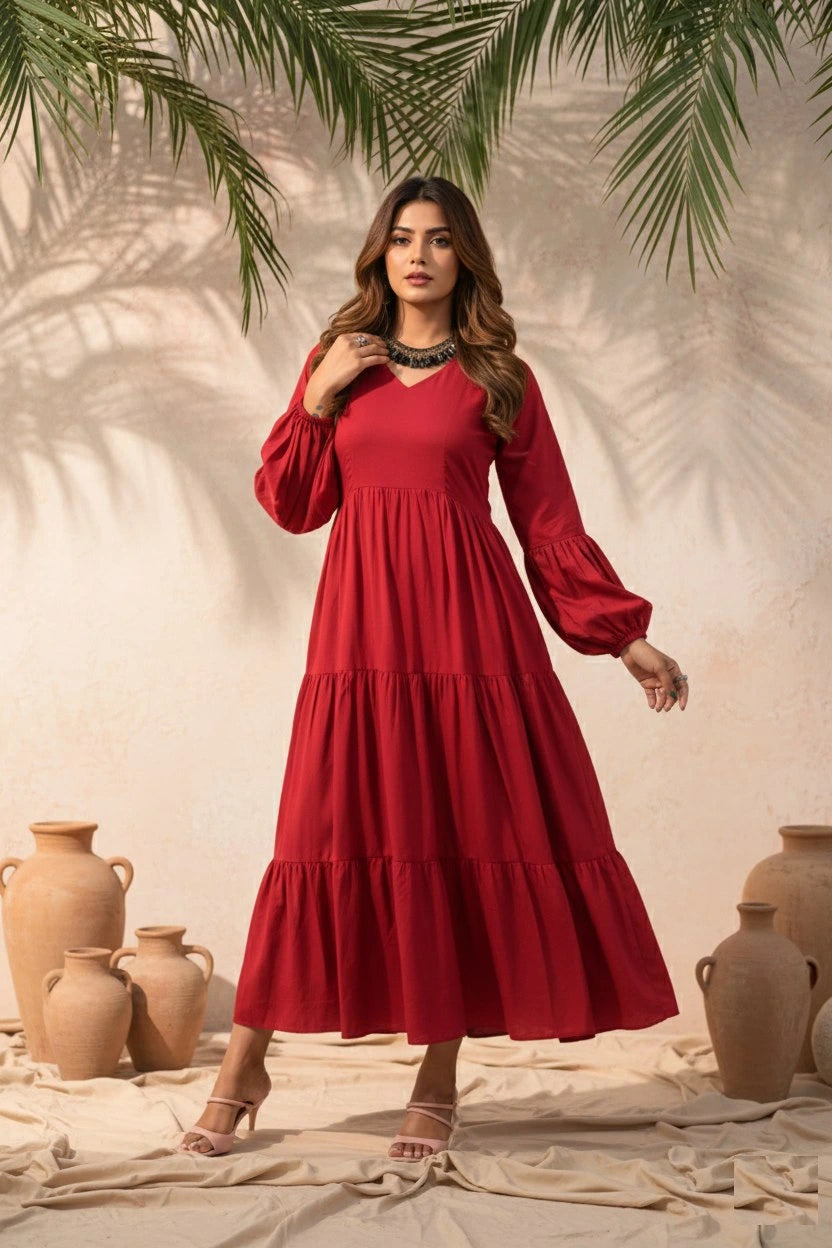Woman in a red dress standing in a rustic setting with pots and plants.