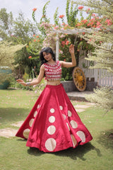 Stylish ethnic outfit combining a contemporary mirror work blouse with a graceful full-flare designer skirt.