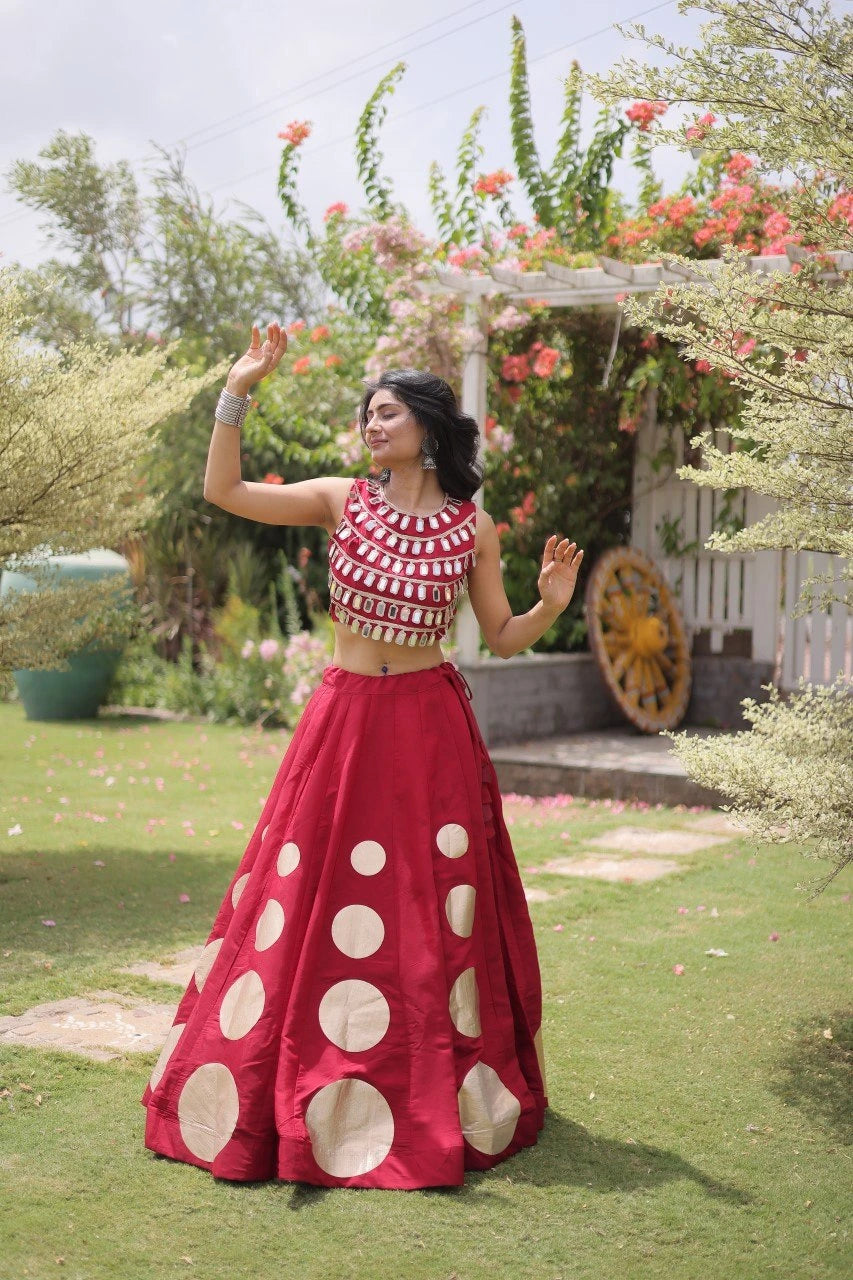 Designer festive lehenga crafted with shimmering mirror embellishments and premium fabric for a vibrant ethnic look.