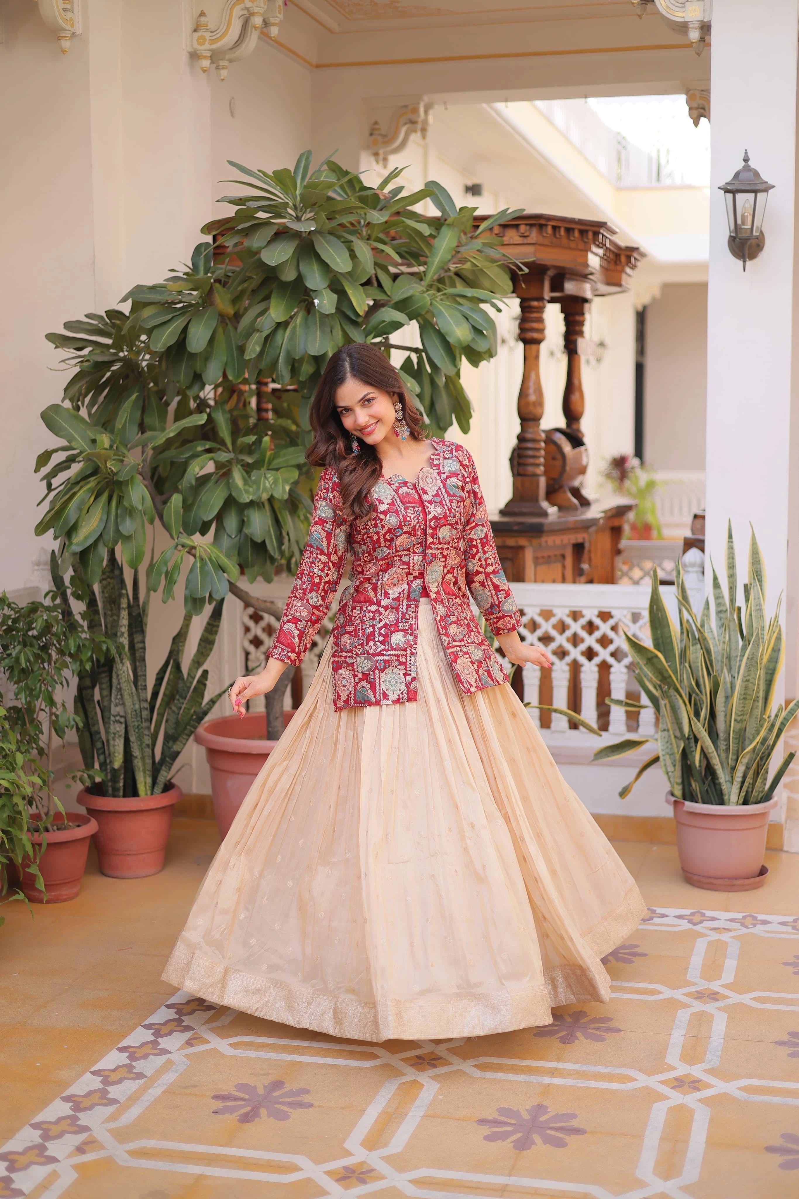 Woman in a red and white traditional outfit standing in a decorated indoor setting with plants.