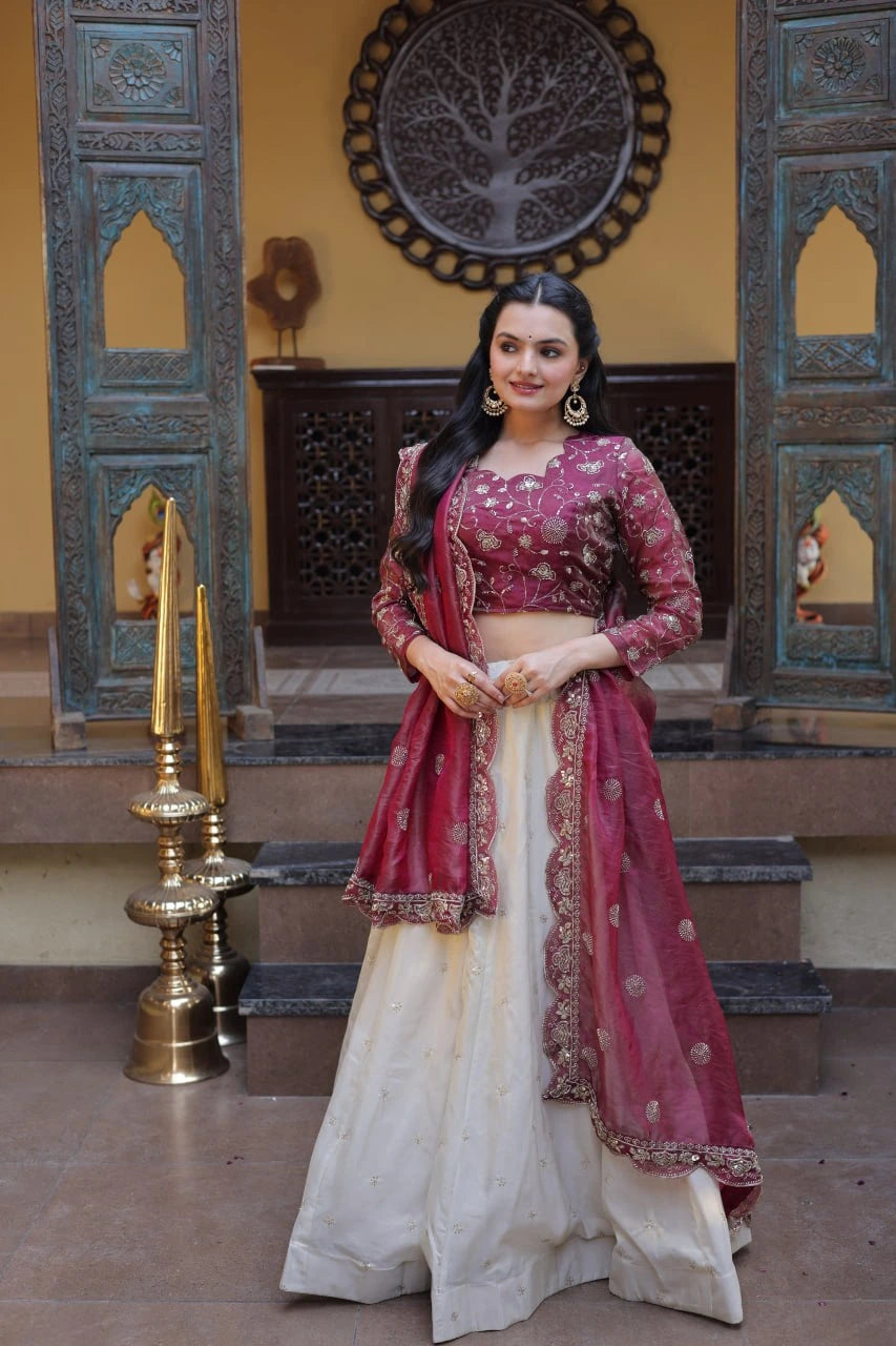 Woman in a traditional outfit standing in an ornate interior setting