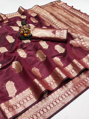 Maroon saree with gold patterns on a white background