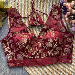 Red floral patterned bralette on a textured surface