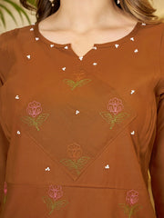 Brown top with floral embroidery and bead details