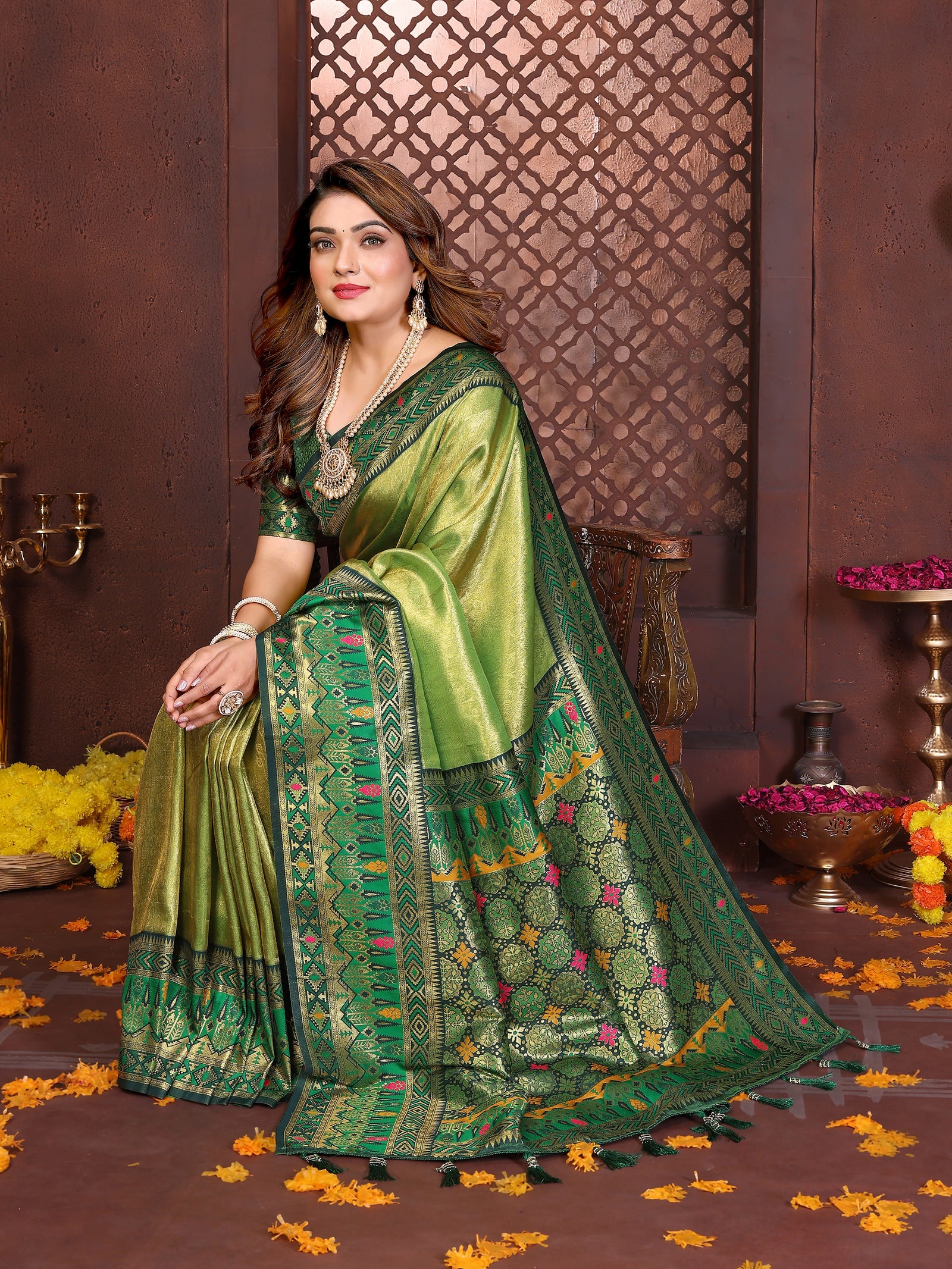 Elegant pure Banarasi tissue silk saree in soft green-yellow shade featuring traditional zari patterns.