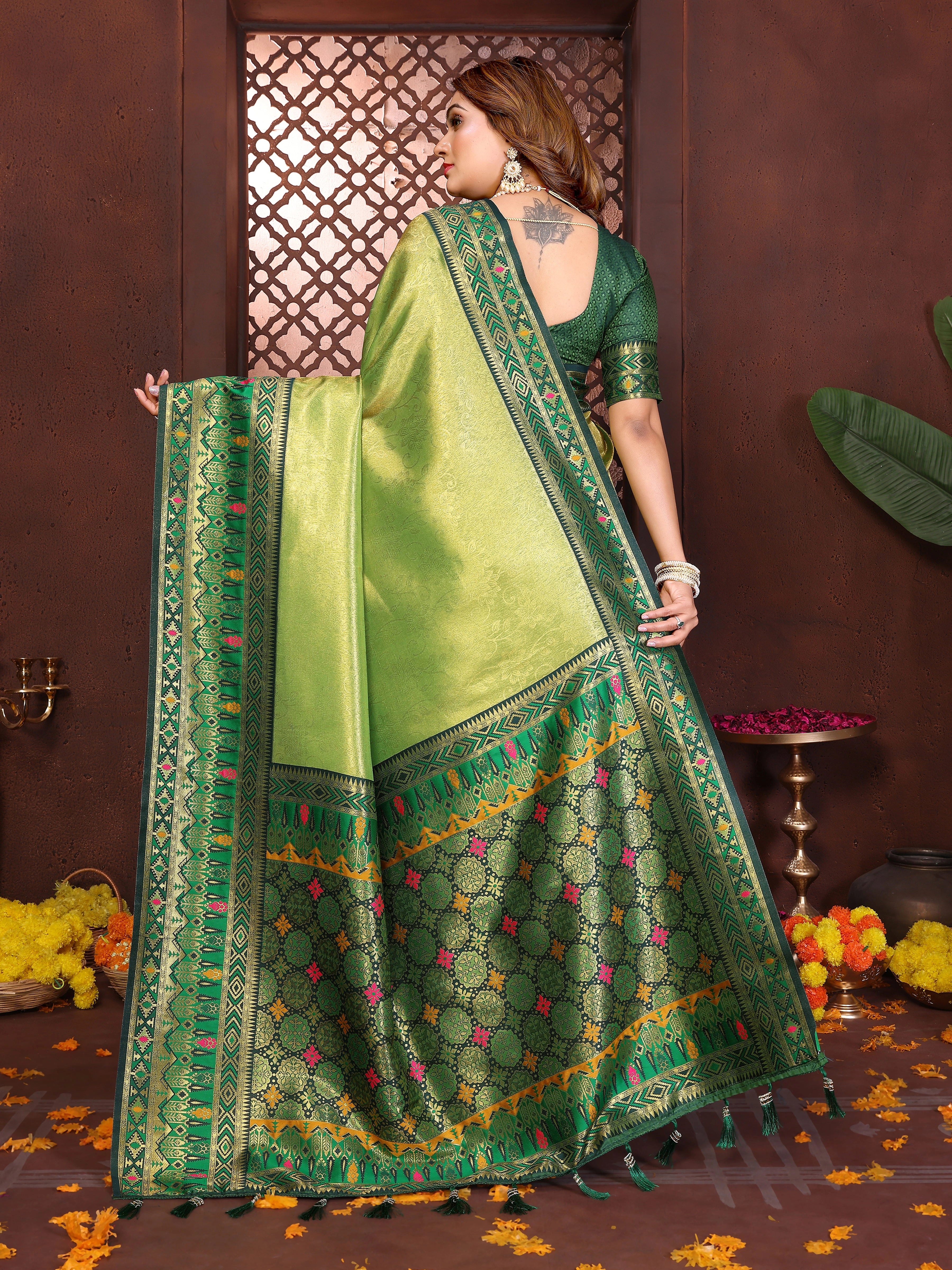Elegant pure Banarasi tissue silk saree in soft green-yellow shade featuring traditional zari patterns.