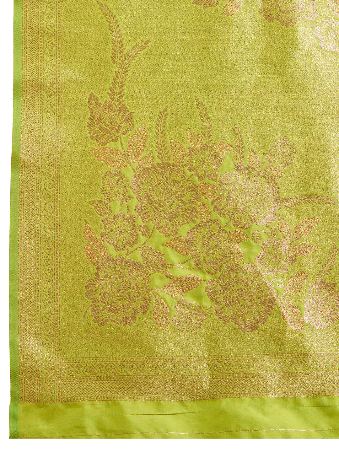 Green fabric with intricate gold embroidery on a matching green background
