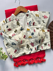 Fabric with cartoon designs on a hanger against a red cloth background
