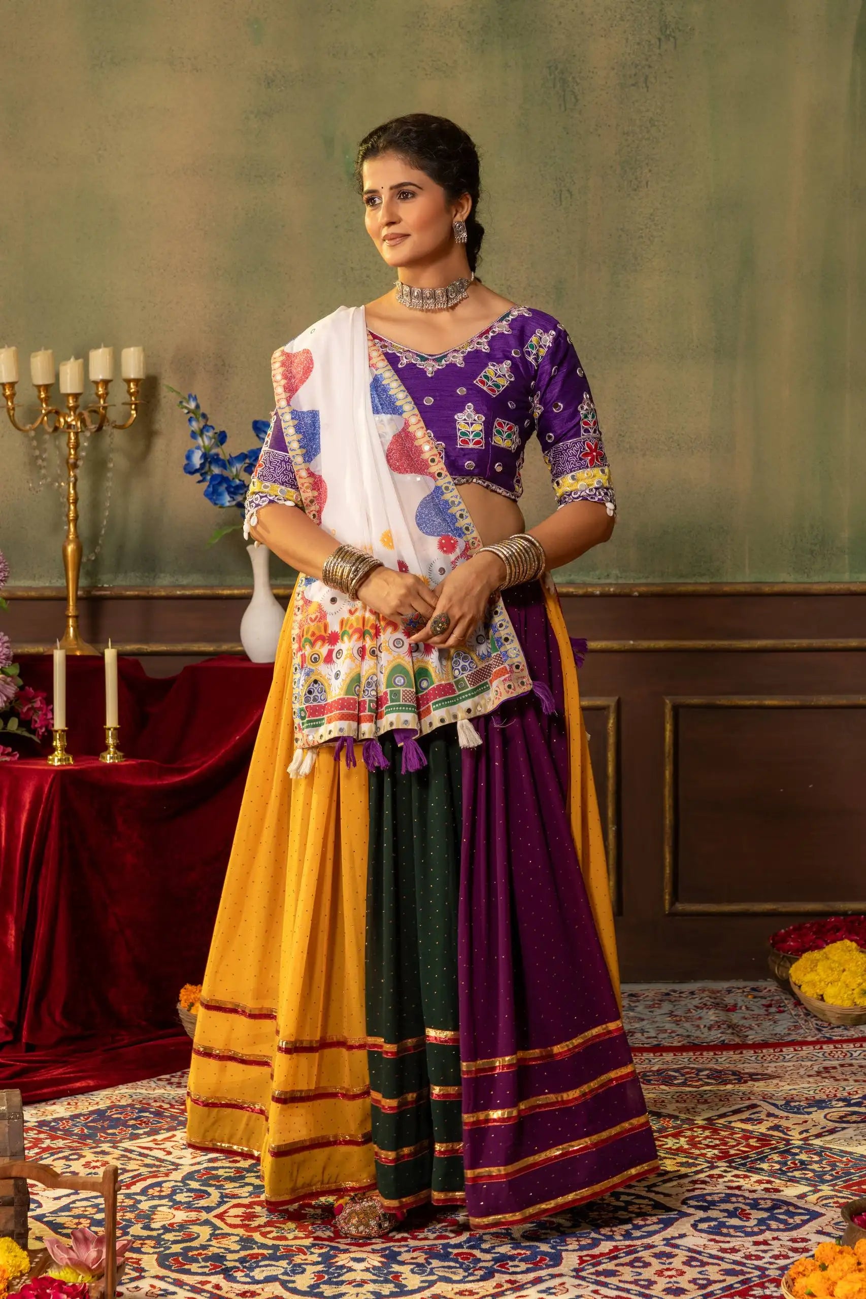 Full length front view of multicolor Kutchi lehenga with mustard, green and purple panels and dupatta