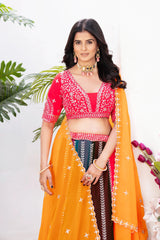 Red embroidered choli with curved neckline, short sleeves and silver zari sequins work close-up