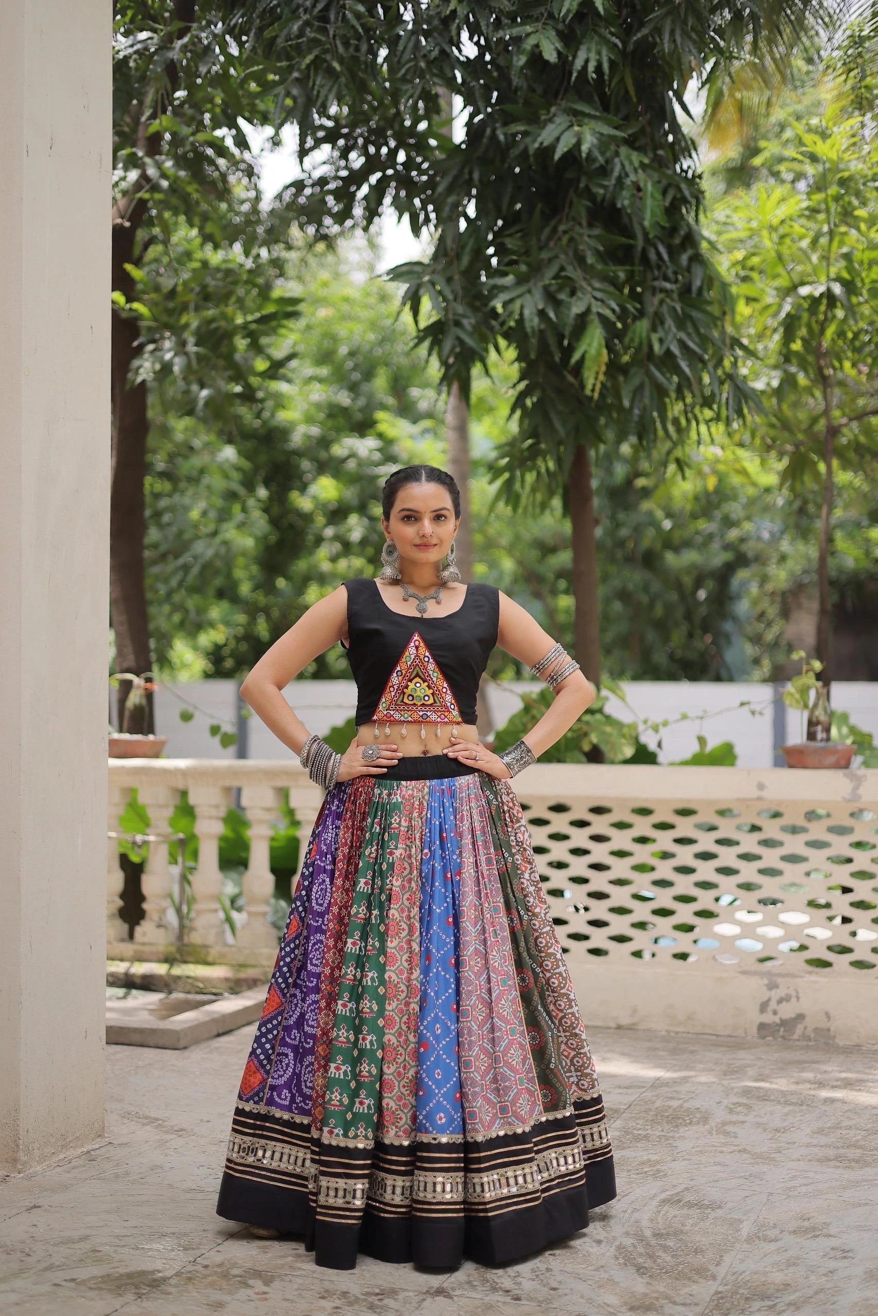 Vibrant multicolor cotton lehenga with digital print, embellished with gota patti and mirror lace work.