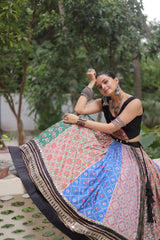 Handcrafted cotton lehenga in multicolor digital print with ornate mirror lace and gota patti accents.