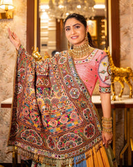 Woman wearing a traditional embroidered saree in an elegant interior setting