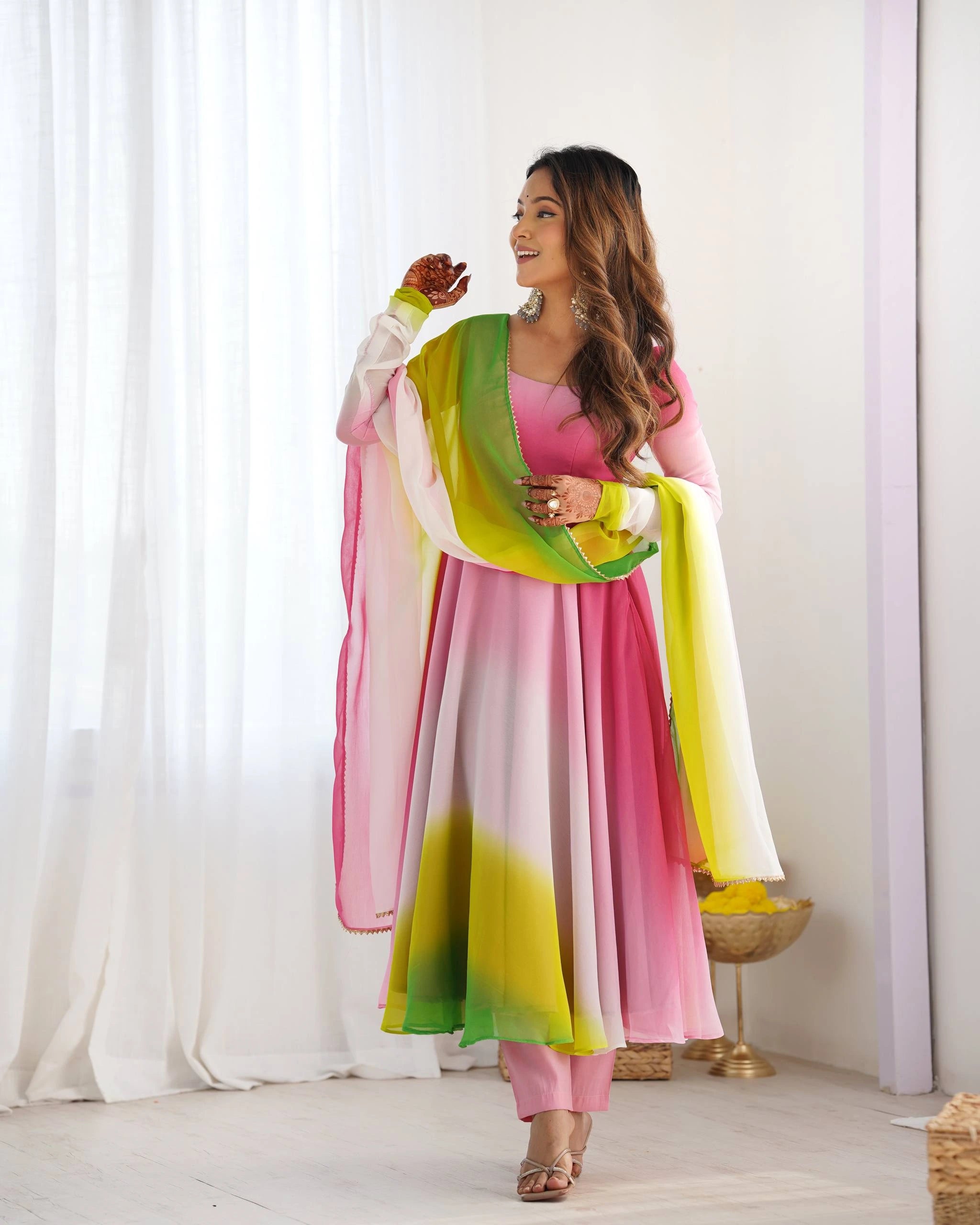Elegant pink georgette suit with floral zari embroidery, round neck, full sleeves, and matching pant with dupatta.