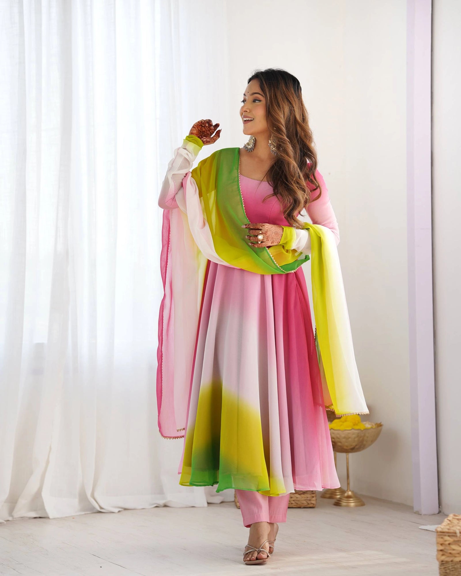 Elegant pink georgette suit with floral zari embroidery, round neck, full sleeves, and matching pant with dupatta.