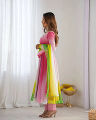 Stylish pink faux georgette suit with floral zari accents, round neckline, long sleeves, and coordinated pant with dupatta.