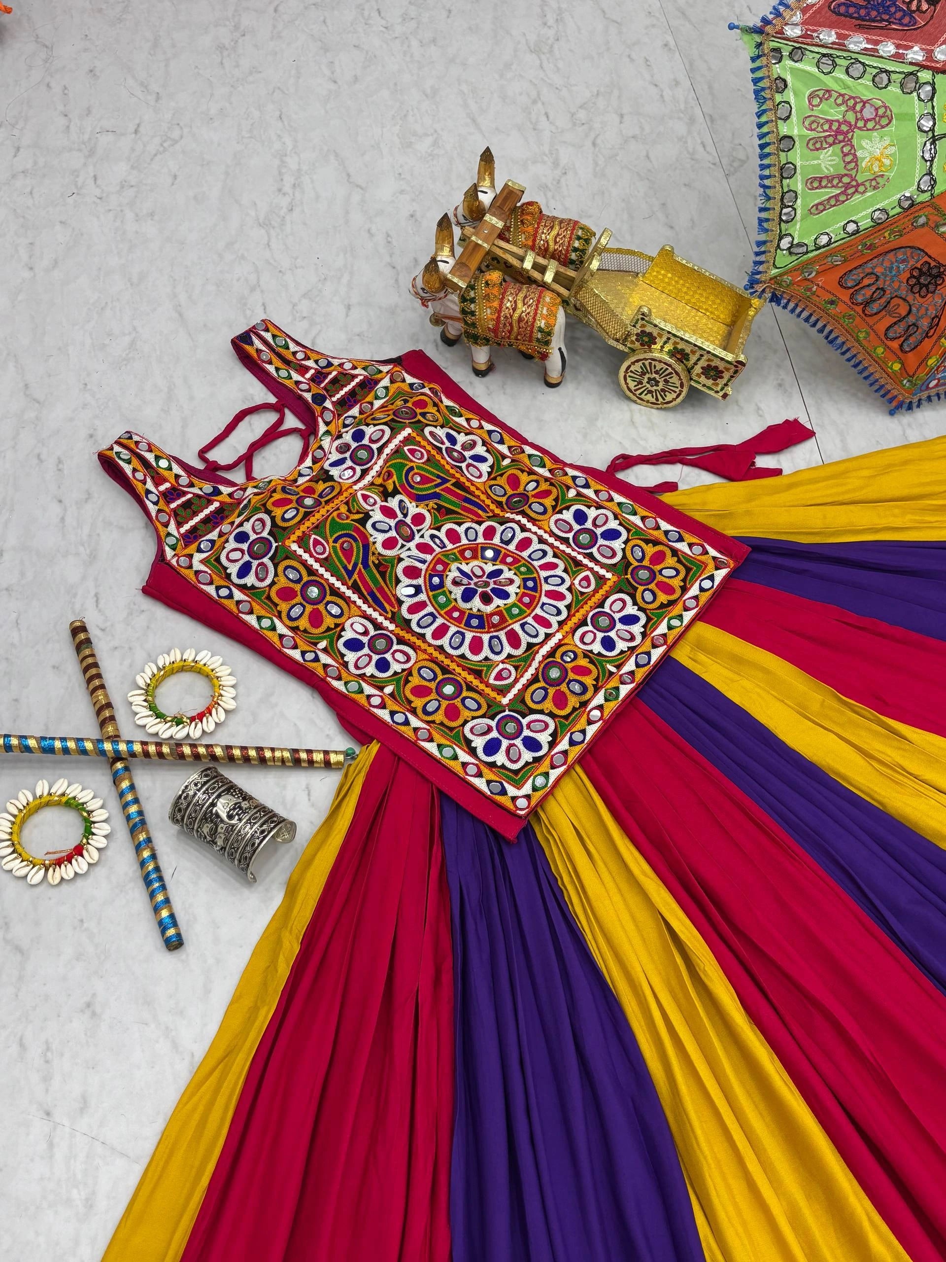 Colorful traditional outfit with intricate patterns on a textured surface