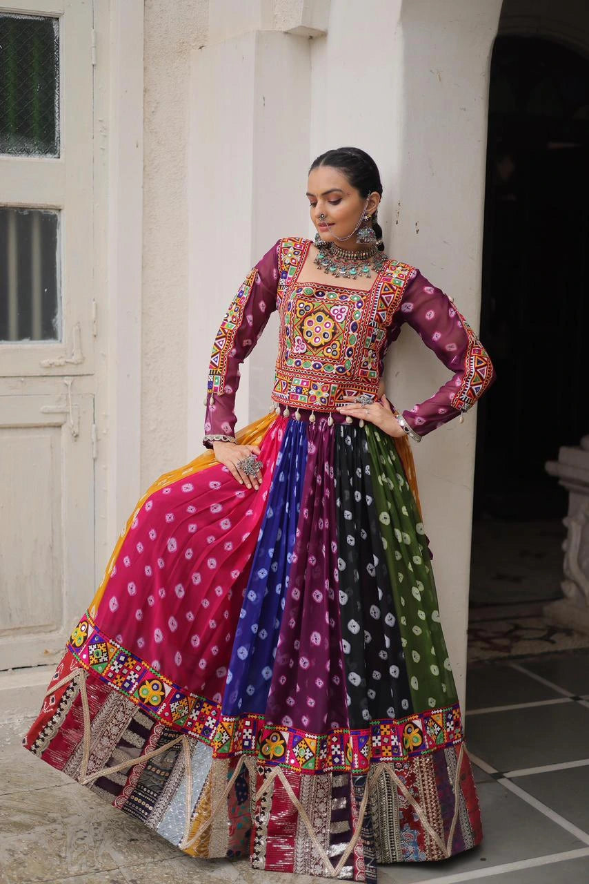Woman wearing a colorful traditional outfit with a patterned top and multicolored skirt.