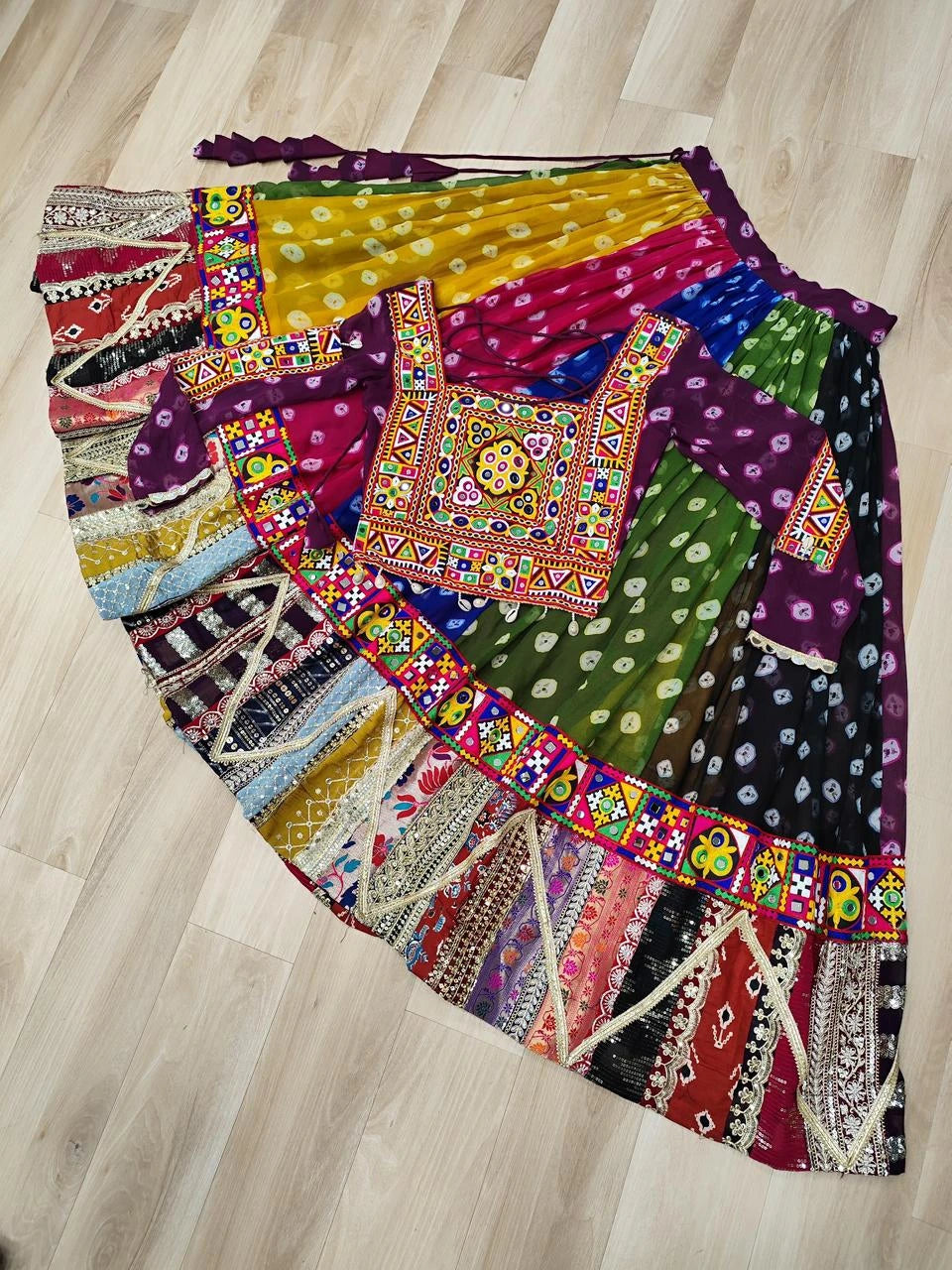 Colorful patchwork skirt on a wooden floor