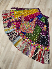 Colorful patchwork skirt on a wooden floor