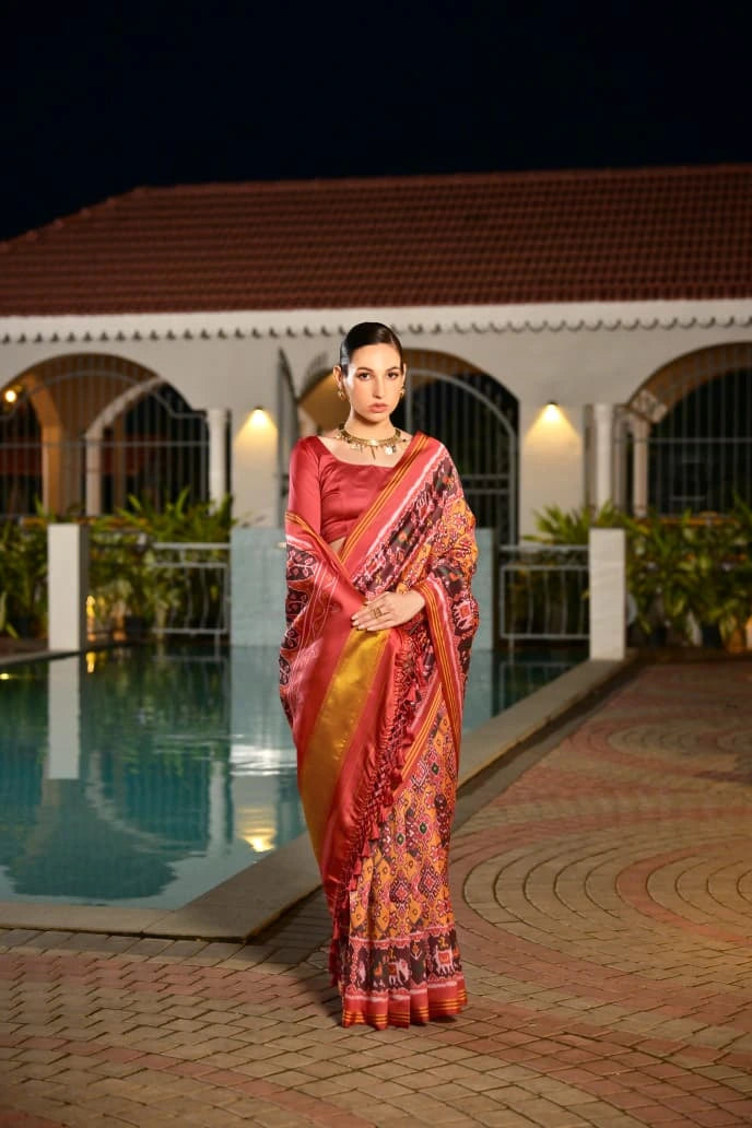 Elegant handcrafted soft silk saree in mustard yellow featuring geometric Ikkat design
