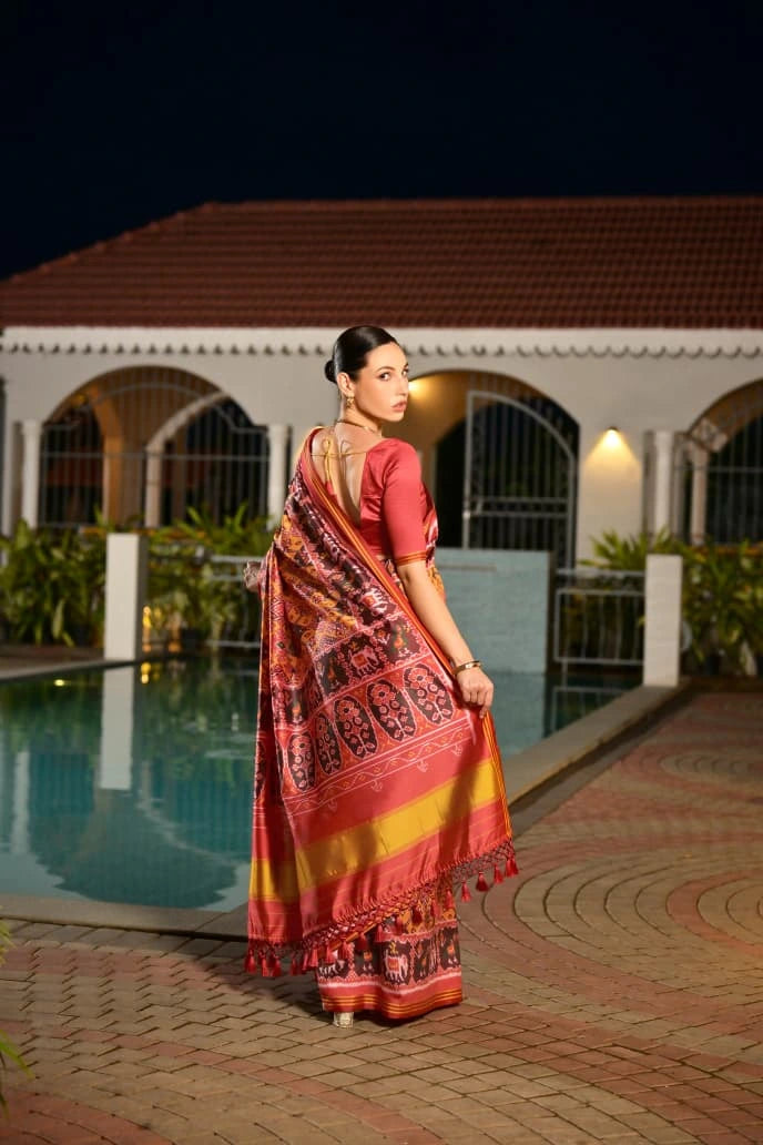 Traditional Indian silk saree in mustard yellow with intricate Ikkat patterns showcased online