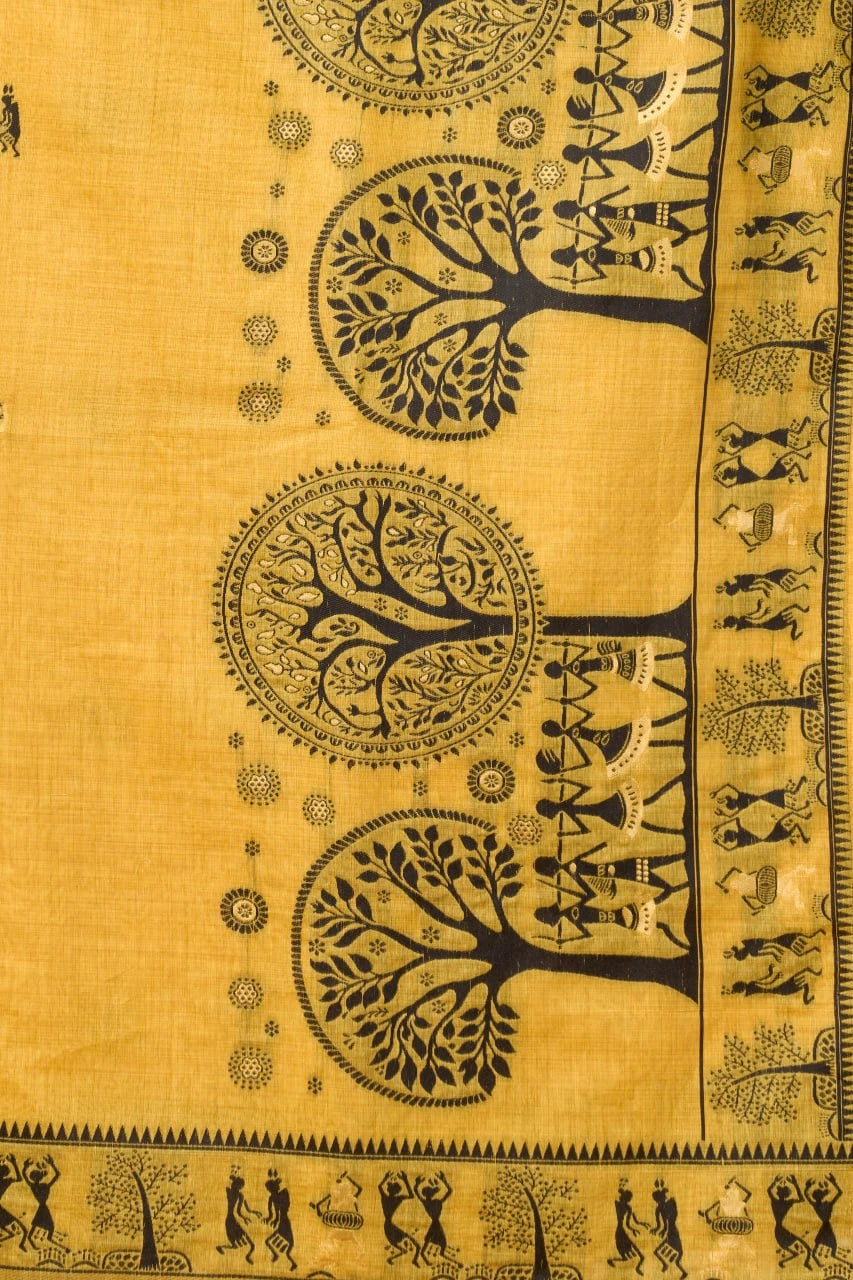 Decorative fabric with black tree and people patterns on a yellow background