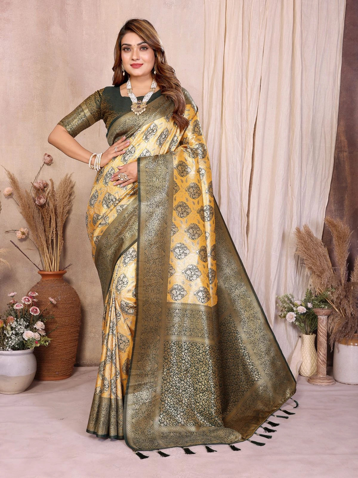 Woman wearing a traditional saree with a floral pattern in a decorated indoor setting