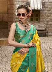 Woman wearing a green and yellow saree with jewelry in an outdoor setting